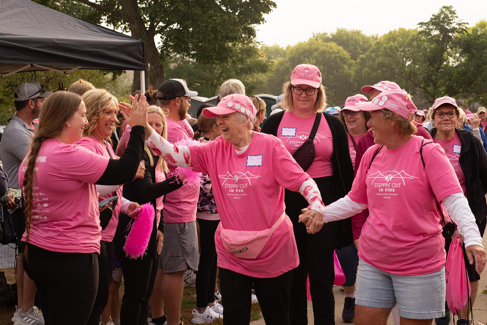Women celebrating at Steppin' Out in Pink event