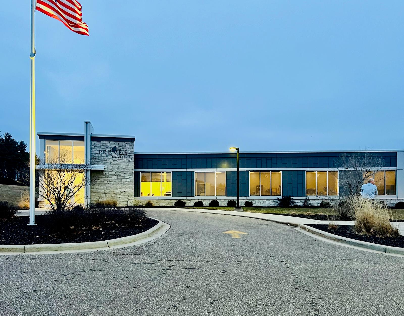 Exterior of Emplify Health's Mondovi Clinic at dusk.